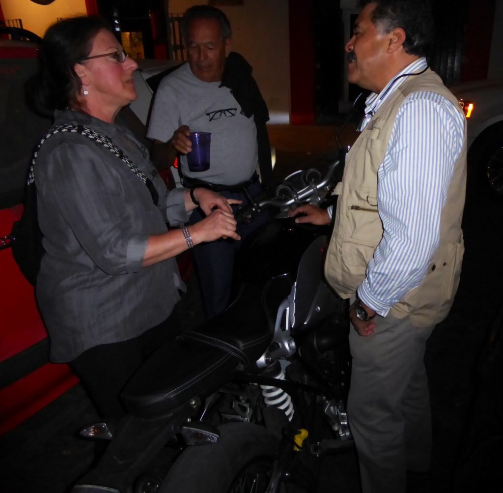 Lea and Paco talking motorcycles